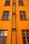 Orange multi storey with fire escape leading