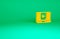 Orange Online play video icon isolated on green background. Laptop and film strip with play sign. Minimalism concept. 3d