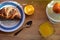 Orange, orange juice and chocolate croissant for breakfast/ conceptual image of good morning