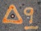 Orange paint marks on asphalt