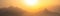 Orange panorama - misty mountains at sunset