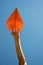 Orange paper airplane