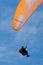 Orange paraglider at Torrey Pines Gliderport in La Jolla