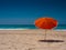 Orange parasol on the beach