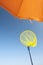 Orange parasol and yellow fishing net