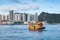 Orange passenger ferry in Hong Kong city