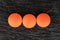 Orange pharmacy tablet on grey stone