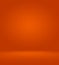 Orange photographic studio background vertical with soft vignette. Soft gradient background. Painted canvas studio