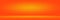 Orange photographic studio background vertical with soft vignette. Soft gradient background. Painted canvas studio