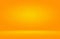 Orange photographic studio background vertical with soft vignette. Soft gradient background. Painted canvas studio