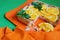 Orange pie on colourful background. Baked meal. Home made. Kitchen background.