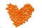 Orange pills in heart shape