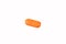 Orange pills on a white background close-up. Insulators