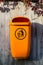 Orange plastic dust bin