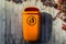 Orange plastic dust bin