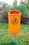 Orange plastic dust bin