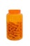 Orange plastic medical small bottle filled with capsules without cover on a white background