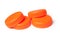 orange plastic plugs for recycling on white background