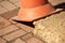 Orange plastic traffic cone on pavement