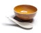 Orange plate and china spoon
