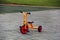 Orange playground tricycle