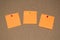 Orange Post it Notes on a Cork Board