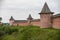 An orange protective brick wall with towers in small village - Suzdal, Russia