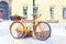 Orange provence rural bicycle with fruits in wicker basket.