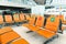 Orange public seats in the airport Inside the airport terminal