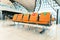 Orange public seats in the airport Inside the airport terminal