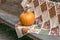 Orange pumpkin on a handmade fall quilt