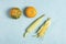 Orange pumpkin, yellow corn cobs  on a blue concrete background, flat lay