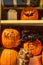 Orange pumpkins carved into faces and text Halloween decorations