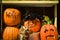 Orange pumpkins carved into faces and text Halloween decorations