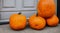 orange pumpkins in front of a house, concept halloween october of fear and terror in high resolution