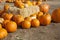 Orange Pumpkins and Hay in Rustic Fall Setting