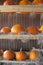 Orange pumpkins in racks with hay detail