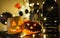 Orange pumpkins with scary faces and candles lies on the table dark background. Halloween celebration, home decoration