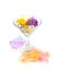 Orange and purple violet flowers float in martini glass with hand painted watercolor blot on white background. Design element,