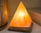 The orange pyramid-shaped salt lamp is made of natural crystal rock salt, which acts as a tonic anti-stress source, health