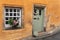 Orange quaint house in picturesque village of Culross, Scotland, UK - Outlander TV series location