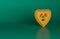 Orange Radioactive in shield icon isolated on green background. Radioactive toxic symbol. Radiation Hazard sign