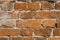 Orange ragged brick wall. Old red brick wall backgrounds. Close up