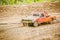 Orange rally car trailing