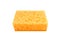Orange rectangular porous washing sponge isolated on a white background