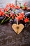 Orange Red Freesia Laxa flowers with black massage stones and bu