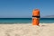 Orange rescue buoy on the beach