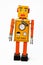 Orange retro robot wind up toy.