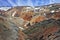 The orange rhyolite mountains with snow