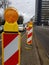 Orange road signs warn of road works
